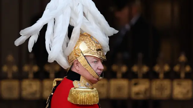 A member of the King's Body Guards of the Honourable Corps of Gentlemen at Arms arrives at the Palace of Westminster ahead of the State Opening of Parliament in the House of Lords, London. Picture date: Tuesday November 7, 2023. PA Photo. King Charles III is delivering his first King's speech as monarch, having previously deputised for the late Queen to open parliamentary sessions.