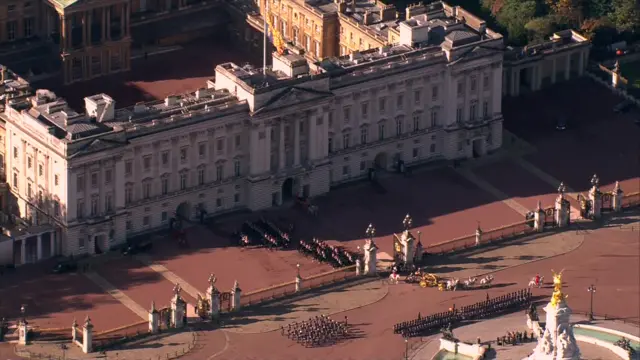 Ariel view of the King and Queen's carriage leaving Buckingham Palace