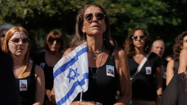 Members of the public gather in Dizengoff square to observe a silence and vigil to mark the one month anniversary of the attacks, on November 07, 2023 in Tel Aviv, Israel.