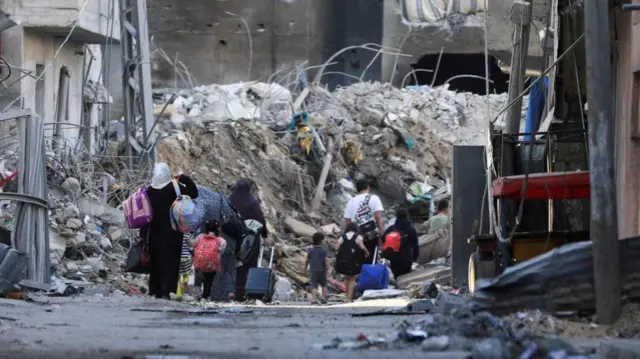 People leaving Gaza City on Tuesday