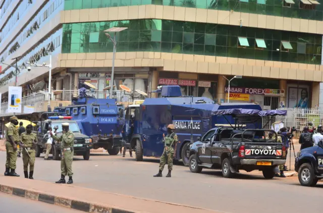 Security forces stand guard around sites after two blasts occurred with one just meters away from the main gate to the country's parliament and the other near the city's central police station, in Kampala, Uganda on November 16, 2021