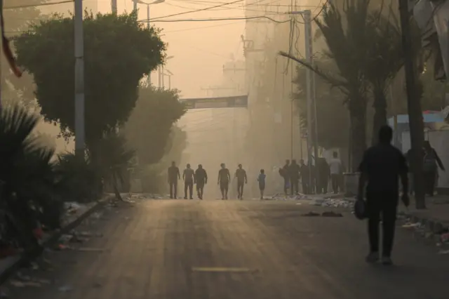 People flee their homes on the edges of Beach refugee camp, in Gaza City,