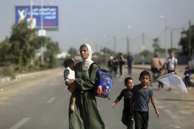 Palestinians flee Gaza City to the southern Gaza Strip on Salah al-Din street in Bureij, Tuesday, Nov. 7, 2023.