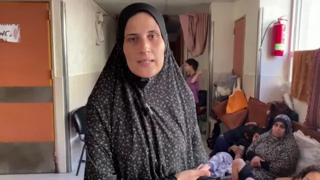 Lama speaking in a hospital corridor