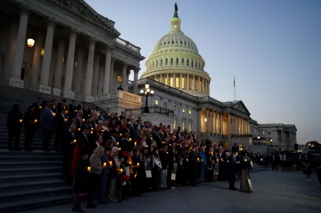 Members of the US House of Representatives during a bipartisan candlelight vigil for Israeli victims and hostages on the steps of the US Capitol in Washington