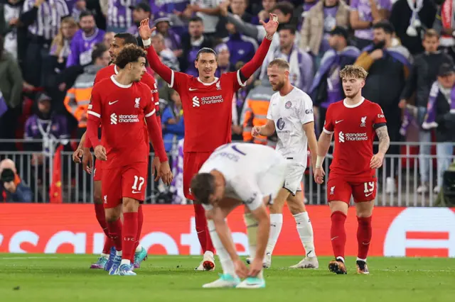 Nunez celebrates his goal  Toulouse with teammates as the away side stand at kick off.