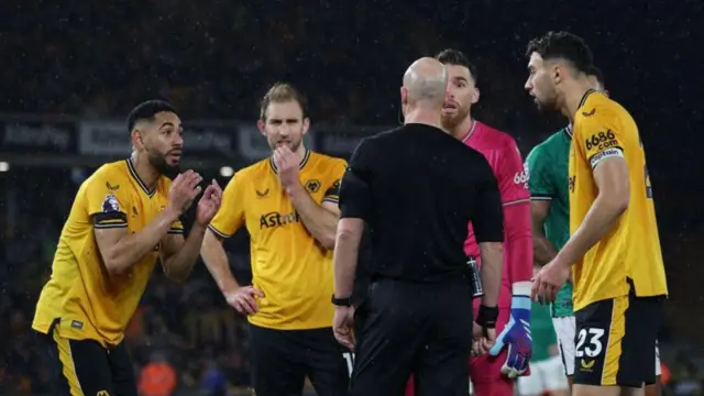 Wolves players protest to referee