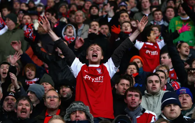 York fans cheer the team on during their FA Cup third round tie at then-Premier League side Bolton in 2011