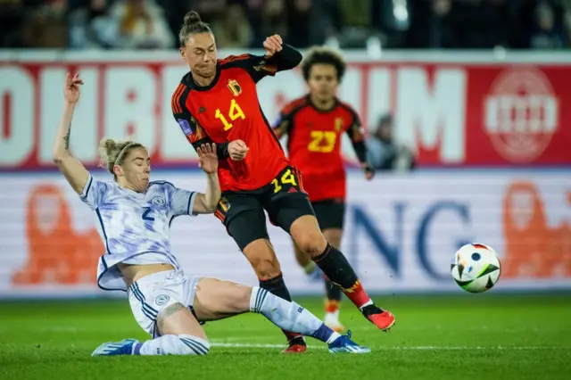 Scotland's Nicola Docherty and Belgium's Davinia Vanmechelen fight for the ball