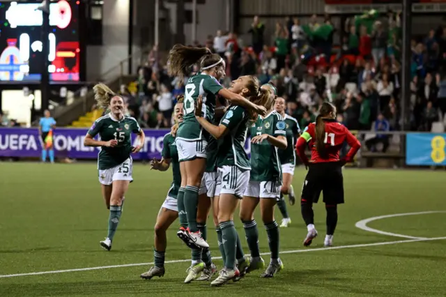 Northern Ireland players celebrate a goal v Albania.