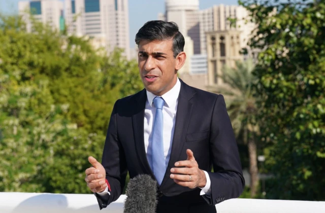 Prime Minister Rishi Sunak on the roof of the British Embassy in Dubai conducting media interviews before attending the Cop28 summit.