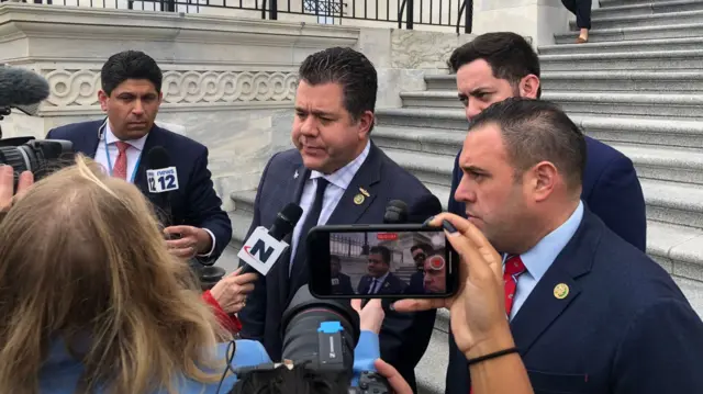 Lawmakers outside the US Capitol