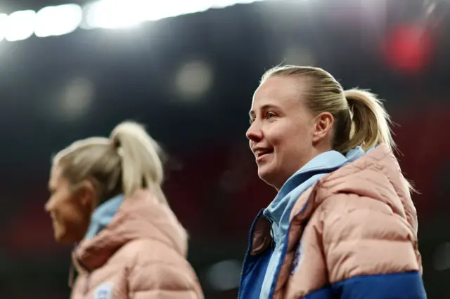 Beth Mead smiles as she strolls around the Wembley pitch.