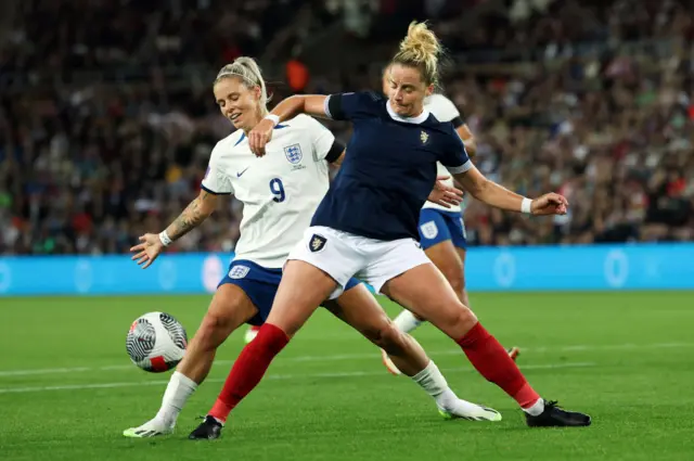 Scotland's Sophie Howard challenges England's Rachel Daly