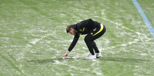 A player inspects the pitch during the Sky Bet Championship match between Preston North End and Queens Park Rangers at Deepdale