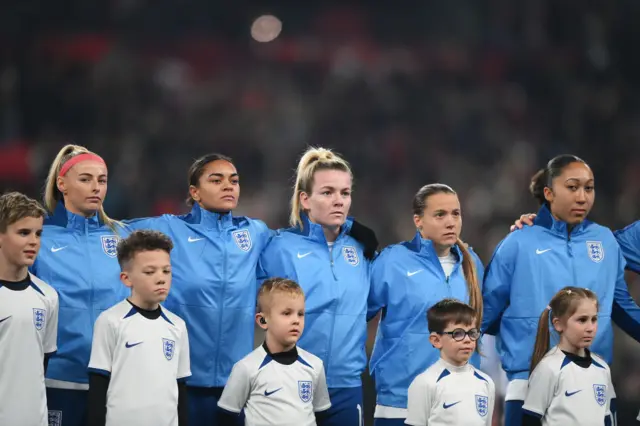 England players line up for the anthems.