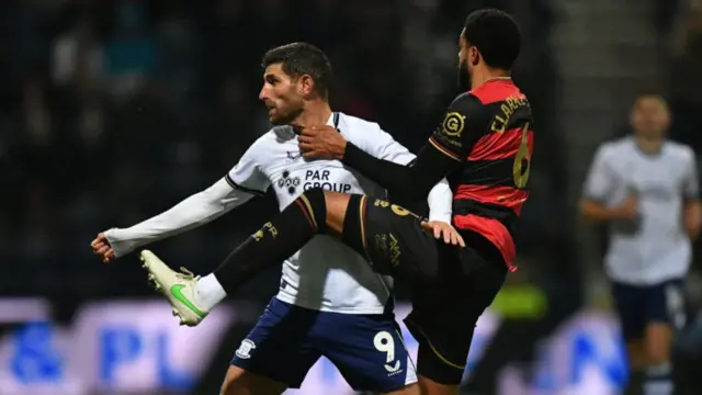 Ched Evans of Preston and QPR's Jake Clarke-Salter