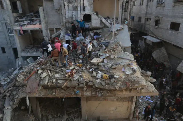 Debris around residential buildings in Gaza