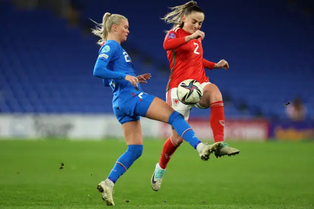 Lily Woodham of Wales battles for possession with Hafrun Rake Halldoersdoettir of Iceland during the UEFA Womens Nations League match