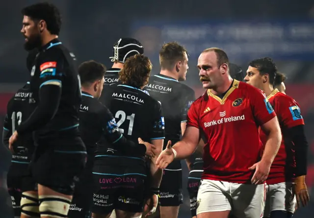 Munster and Glasgow Warriors players shake hands at full time