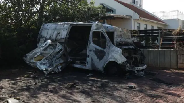 Damage to a vehicle that was hit by a rocket, in Israel near the border with Gaza