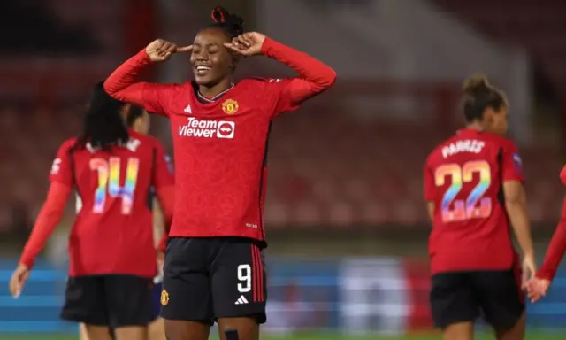 Melvine Malard puts her fingers to her head celebrating her second goal