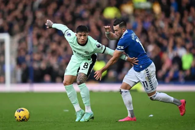 Enzo Fernandez is challenged by Jack Harrison