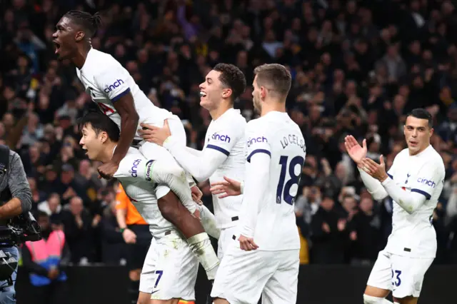 Yves Bissouma jumps onto the back of Son Heung-Min