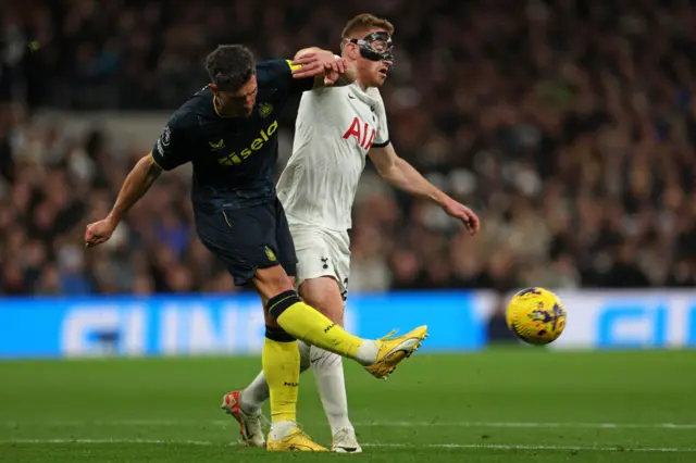 Fabian Schar vies with Dejan Kulusevski