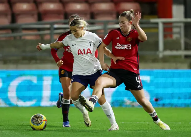 Maya Le Tissier of Manchester United challenges for the ball with Celin Bizet