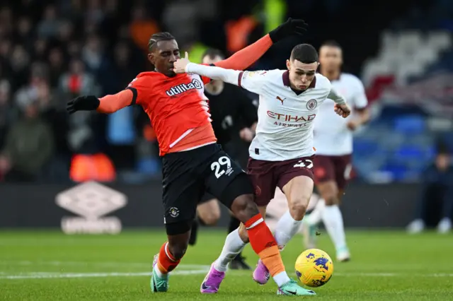 Amari'i Bell with Phil Foden