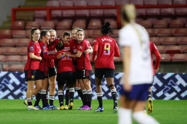 Malard runs to join her teammates to congratulate Blundell for the assist.