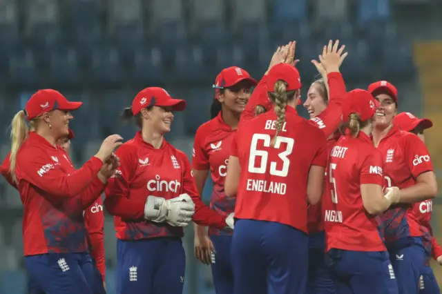 England celebrating a wicket