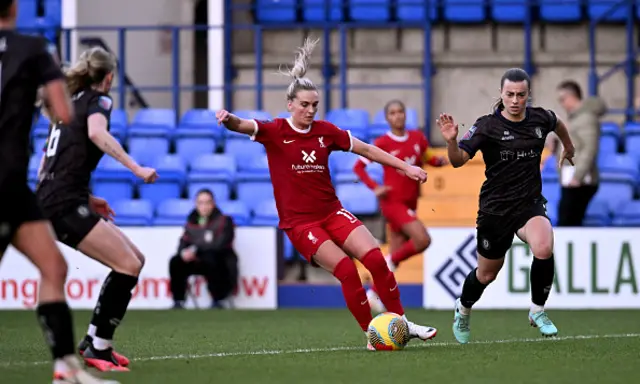 Melissa Lawley on the ball as defenders look on