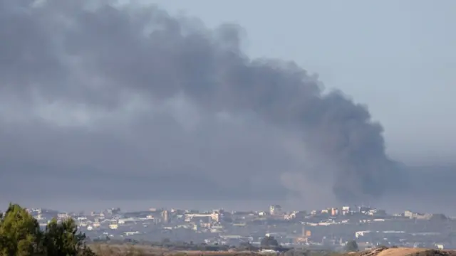 Smoke rises after an air strike by Israeli forces in the northern Gaza Strip, as seen from Sderot