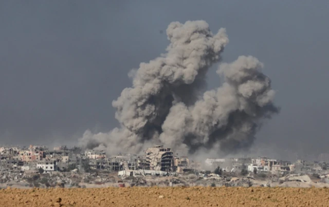 Smoke rises from inside the Gaza Strip