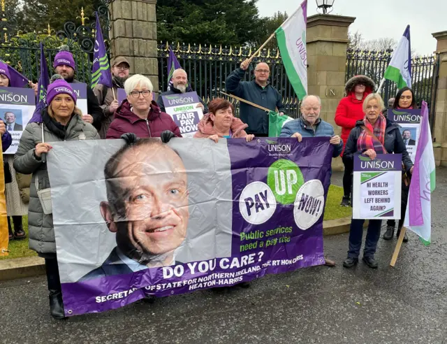 The protestors held a banner to lobby NI Secretary Chris Heaton-Harris