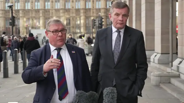 Mark Francois and David Jones standing in front of microphones