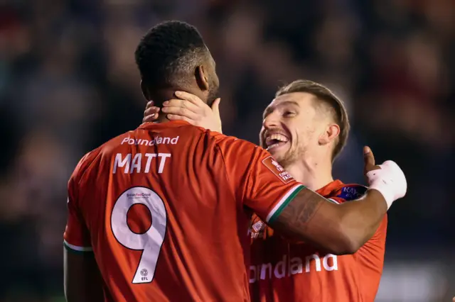 Walsall's Jamille Matt celebrates his goal against Alfreton with team-mate Tom Knowleshe op