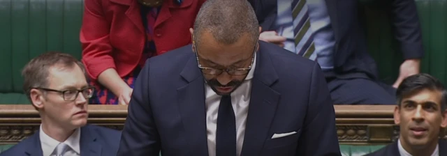 Rishi Sunak sits in the House of Commons next to Illegal Migration Minister Michael Tomlinson