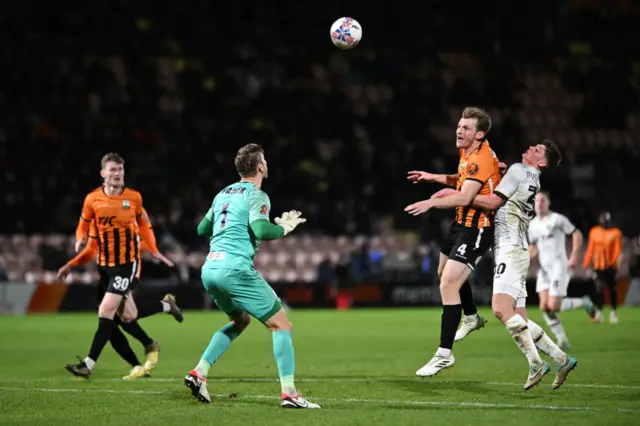 Barnet's Danny Collinge heads an own goal