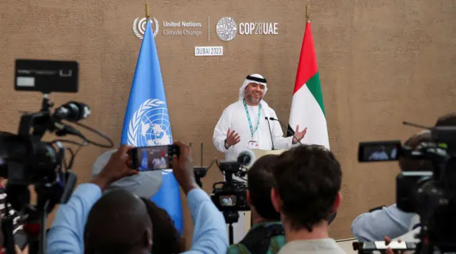 Press gather around COP28 director general Majid Al Suwaidi during a press conference