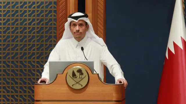 Sheikh Mohammed bin Abdulrahman al-Thani speaking at a podium