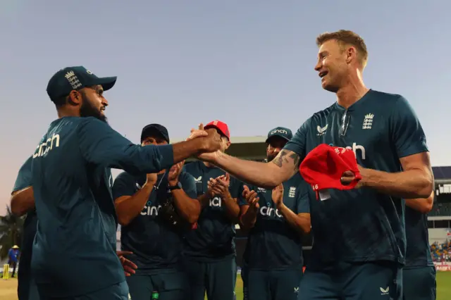 Adil Rashid recevies his 100th T20I cap from Andrew Flintoff