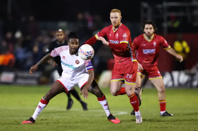 Walsall's Donervon Daniels (left) battles for possession with Alfreton Town's Ryan Taylor in the FA Cup
