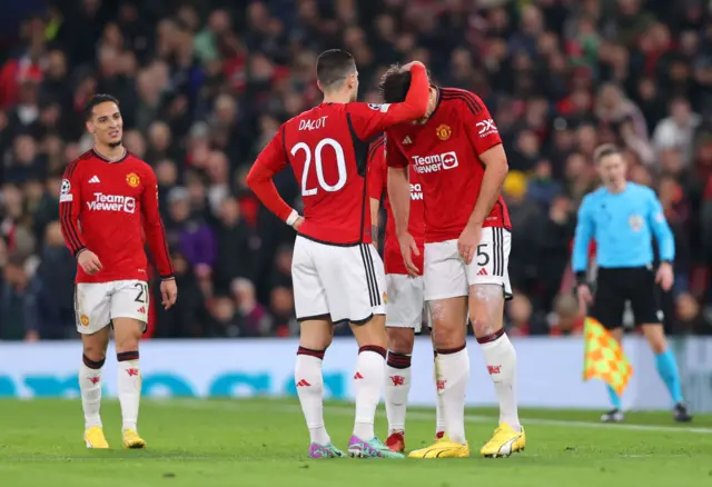 Diogo Dalot and a dejected Harry Maguire
