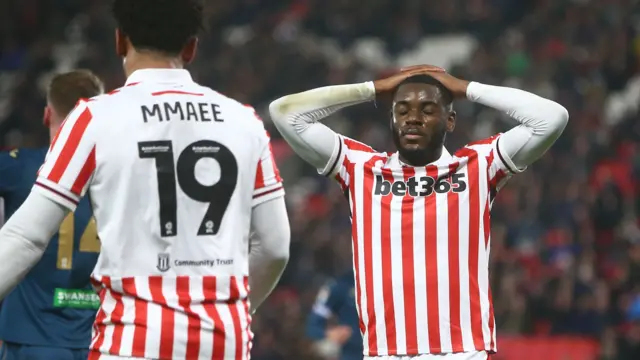 Junior Tchamadeu reacts to missing chance for Stoke