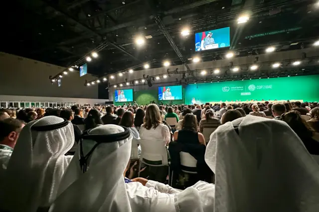 Hundreds gathered in the conference hall for the final moment