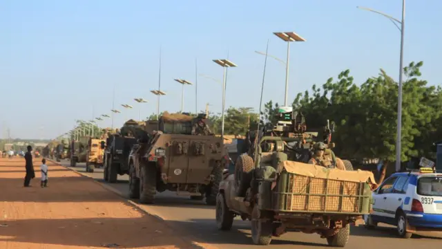 A convoy of French troops based in Niger drives by as they prepare to leave Niger, in Niamey, Niger October 22, 2023.