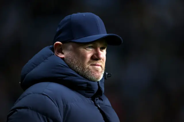 Wayne Rooney in cap grimaces as Birmingham toil against Coventry